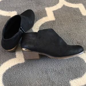 Black ankle boots with gold heel detail